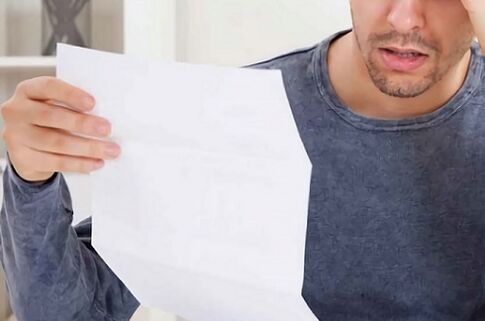 A man studying a resume of prostatitis medicine